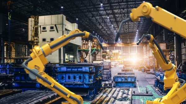 Automated production line with robotic arms and HMI systems in Industry 4.0